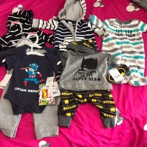 5 newborn outfits. 4 are brand new with tags